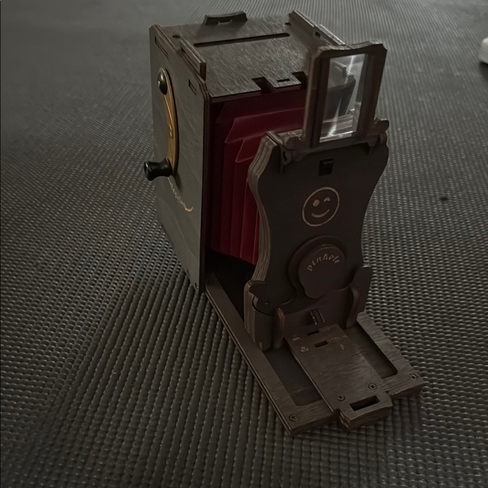 Red and Brown Simulated Camera with Vintage Aesthetic